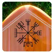 Schwarzer Vegvísir-Aufkleber auf einer Holzoberfläche