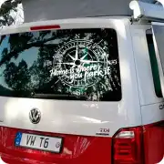 “HOME IS WHERE YOU PARK IT” compass design applied to a camper van’s rear window