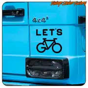 LET’S design with bicycle icon applied to the rear of a blue vehicle
