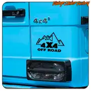 4X4 OFF ROAD sticker applied to the door of a blue off-road vehicle