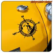 Compass rose with mountain biker applied to a yellow surface
