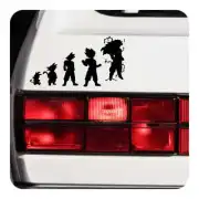 Black silhouettes of five Goku-inspired characters on the rear of a white vehicle