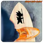 Goku silhouette with staff applied to a surfboard beside a shoe