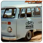 Sticker with bicycle and «WEAPON OF STRESS REDUCTION» text applied to a van