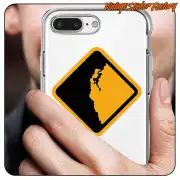 Autocollant carré avec silhouette d’un grimpeur appliqué sur la coque transparente d’un téléphone