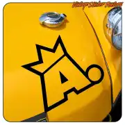 Sticker with black crowned animal symbol applied to the yellow bodywork of a vehicle