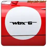 Black WBX6 vinyl applied to a circular red surface