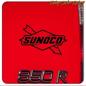 Black Sunoco logo applied to the red bodywork of a vehicle