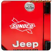 White Sunoco logo applied to the red rear of a Jeep Wrangler