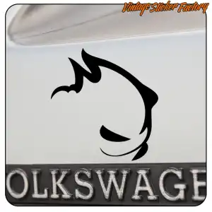 Black rabbit head design applied to a white surface beside Volkswagen lettering