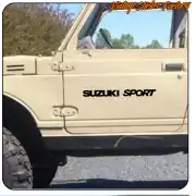 “SUZUKI SPORT” text applied to the door of a beige off-road vehicle