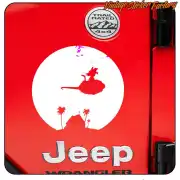 Circular flying cloud and palm tree design applied to the rear of a red Jeep