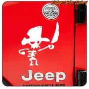 White pirate skull applied to the red rear door of a Jeep