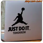 Aufkleber mit der Silhouette einer springenden Person und dem Text «JUST DO IT... TOMORROW» auf einer glatten Oberfläche