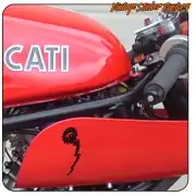Black design applied to the red side panel of a motorbike