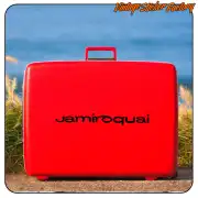 Black JAMIROQUAI text applied to a red suitcase