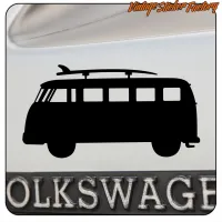 Black silhouette of a camper van with a surfboard on a surface with Volkswagen text