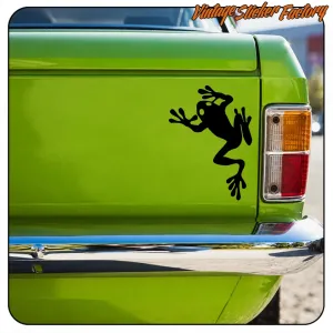 Schwarze Frosch-Silhouette an der grünen Seite eines klassischen Fahrzeugs