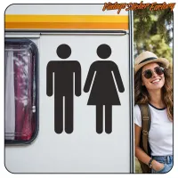 Aplicación de la pegatina de símbolos de baño en el lateral de una caravana