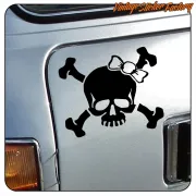 Skull-and-bow sticker applied to the side of a silver vehicle