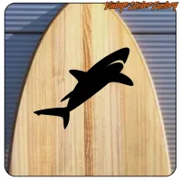 Black shark silhouette placed on a wooden board
