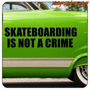 Black “SKATEBOARDING IS NOT A CRIME” text applied to the green side of a vehicle