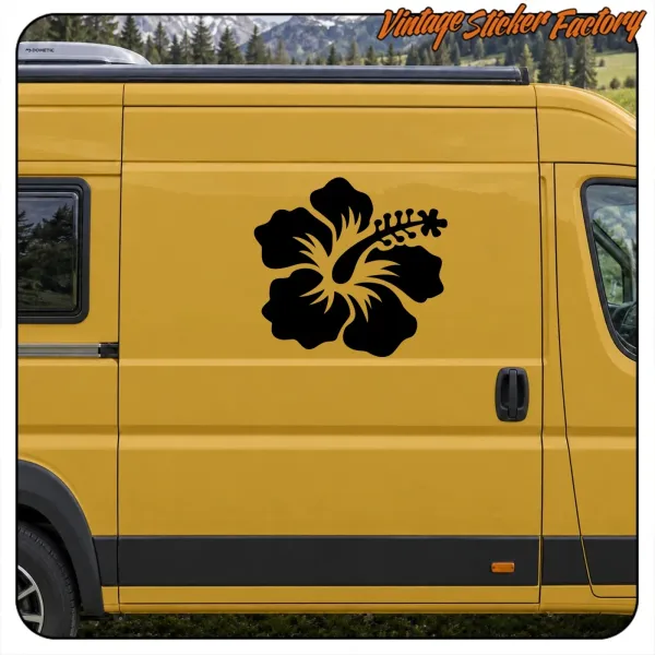 View of a black flower decorating the side of a yellow van