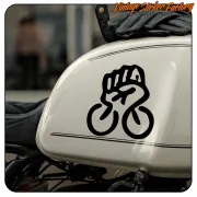 Black fist and bicycle design applied to a motorcycle fuel tank