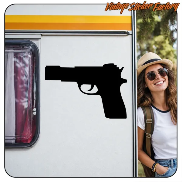 Application of a pistol silhouette on the side of a caravan