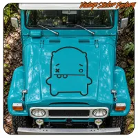 Front view of a blue vehicle with the monster design applied to the bonnet