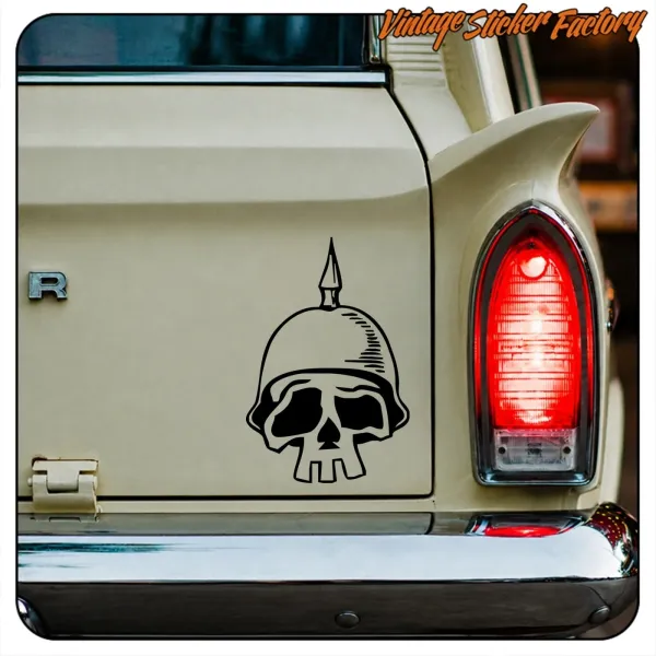 Close-up of a skull wearing a military helmet applied to the rear door of a classic vehicle
