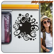 Black ornamental design applied to the side of a caravan