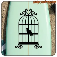 Alternative view of the black decorative cage with a bird on a light green board