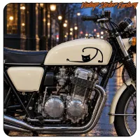 Side view of a classic motorcycle with the black cat design on the tank
