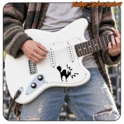 Black cat sticker applied to the body of a white electric guitar