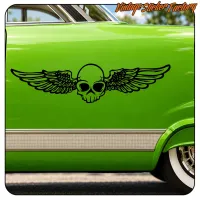 Black winged skull on the green door of a classic car, side view