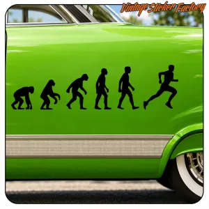 Human evolution in black silhouettes applied to the green side of a classic car