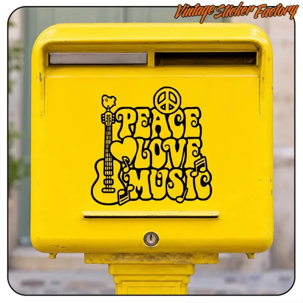 PEACE LOVE MUSIC sticker applied to a yellow letterbox
