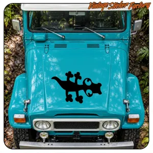 Adhesive black lizard placed on the bonnet of a blue off-road vehicle