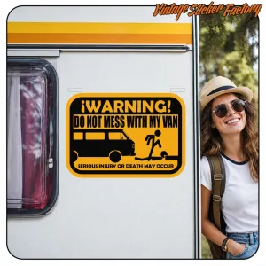 Sticker with English text applied to the side of a motorhome, next to a female traveller