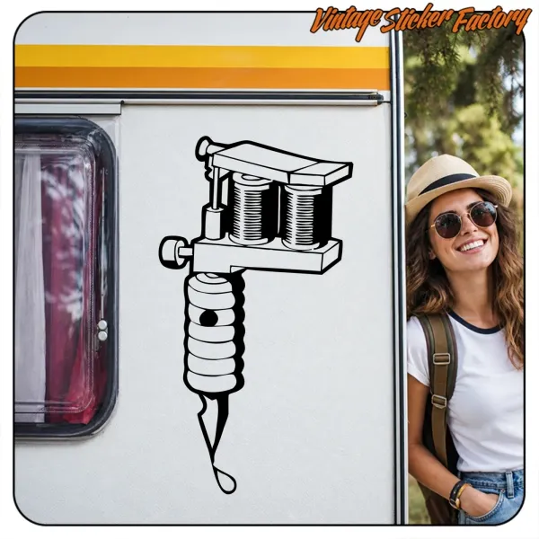 Tattoo machine sticker applied to a caravan, with a person beside it