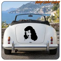 Pin-up vinyl applied to the rear of a white convertible by the sea