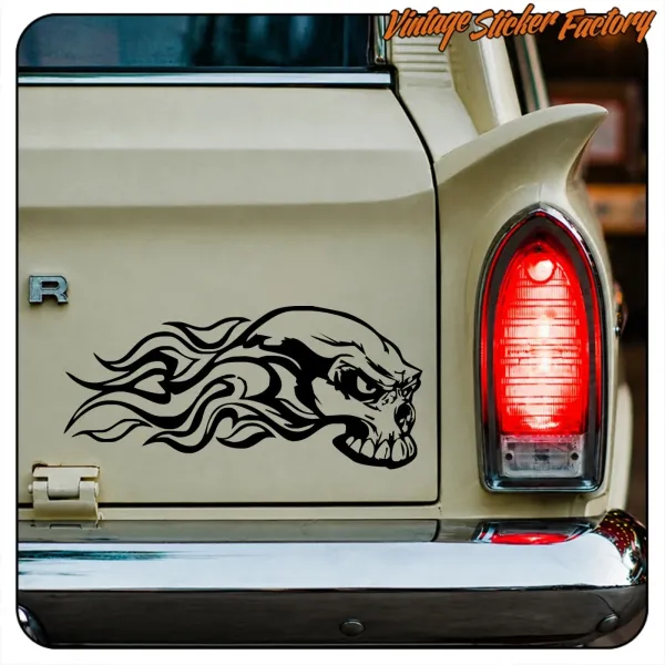 Rear view of a classic vehicle with skull and flames design applied