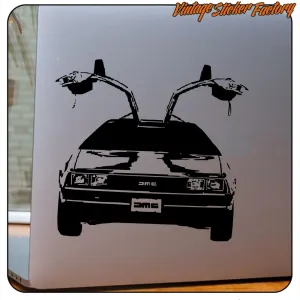 Black DeLorean sticker with open doors applied to a reflective surface