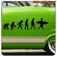 Human evolution vinyl with surfer applied to the bodywork of a green vehicle