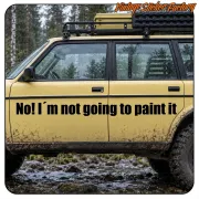 Vehículo todoterreno amarillo con el texto «No! I’m not going to paint it» en la puerta