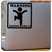 WARNING KNOWS KUNG FU sticker applied to a grey metal surface
