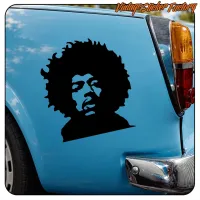 Detalle de la silueta negra de Jimi Hendrix sobre el lateral de un vehículo azul