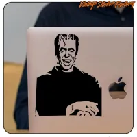 Herman Munster adhesive on a laptop, showing its application on the lid