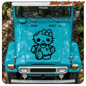 Kitty Zombie sticker applied to the hood of a blue all-terrain vehicle